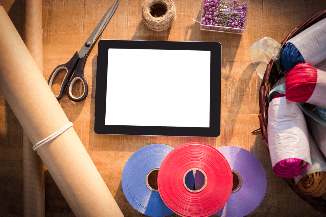 Top View of Crafting Tools with Transparent Digital Tablet Screen