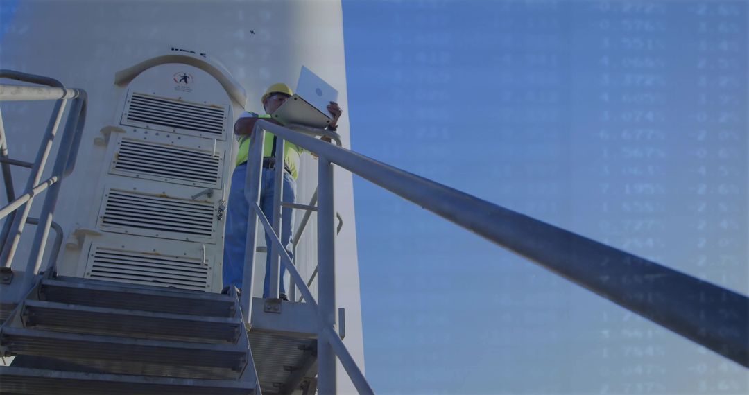 Construction Worker Analyzing Data on Tower Platform Outdoors
