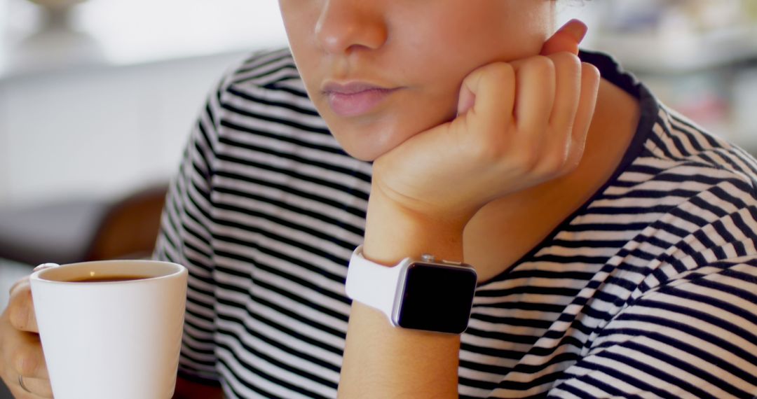 Woman Wearing Smartwatch Holding Coffee Cup, Striped Shirt Fashion - Free Images, Stock Photos and Pictures on Pikwizard.com