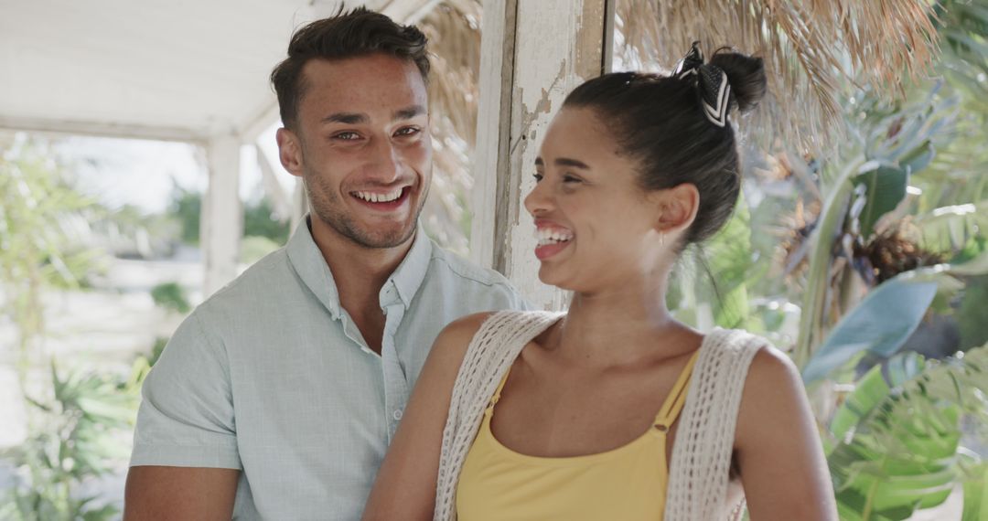 Happy Young Couple Laughing on Tropical Vacation - Free Images, Stock Photos and Pictures on Pikwizard.com