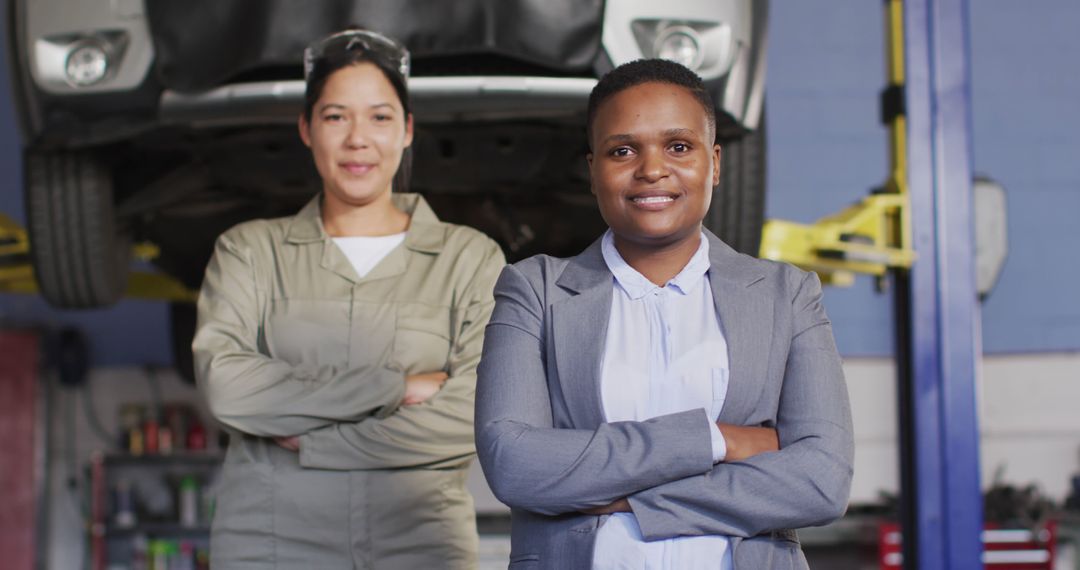 Female Mechanic and Businesswoman Collaborating in Auto Repair Shop - Free Images, Stock Photos and Pictures on Pikwizard.com