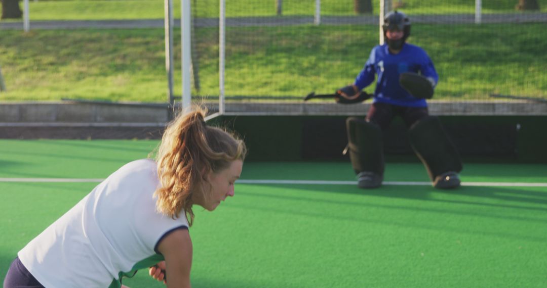 Female Hockey Player During Training Preparing to Hit on Field - Free Images, Stock Photos and Pictures on Pikwizard.com