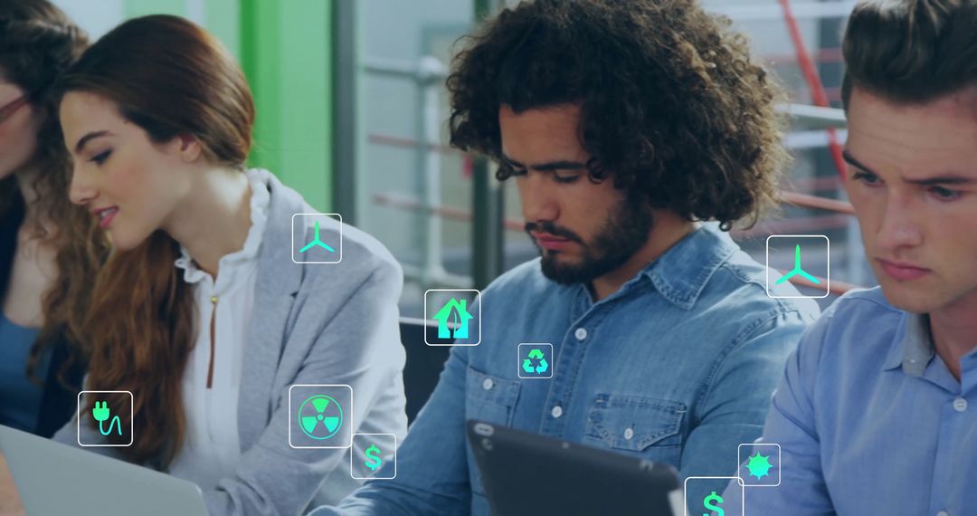 Diverse Colleagues Engaging in Eco-Friendly Office Technology
