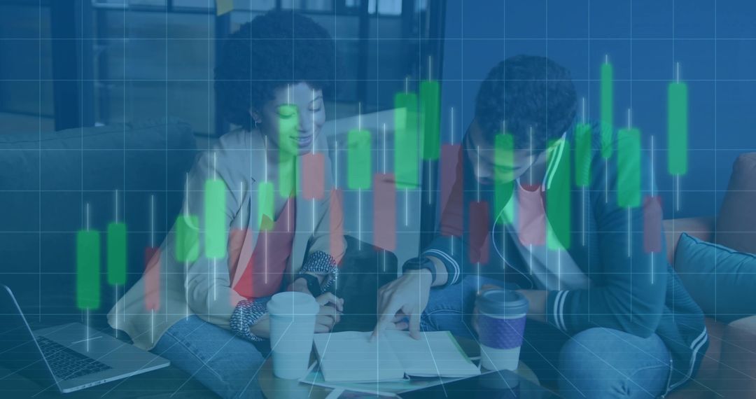 Colleagues Analyzing Financial Trends with Candlestick Chart Overlay