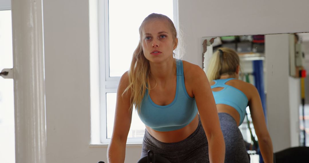 Determined Woman Working Out in Gym - Free Images, Stock Photos and Pictures on Pikwizard.com