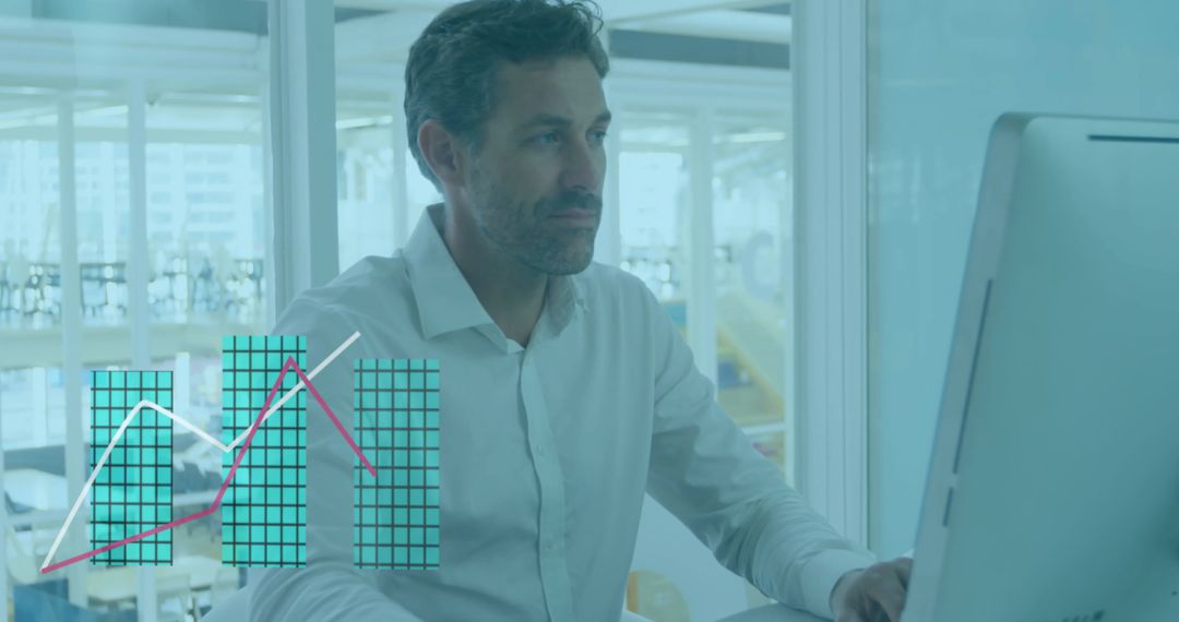 Caucasian Businessman Analyzing Financial Data on Computer in Office