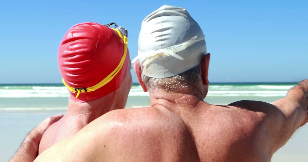 Senior Swimmers Enjoying Sunny Day on Beach - Free Images, Stock Photos and Pictures on Pikwizard.com