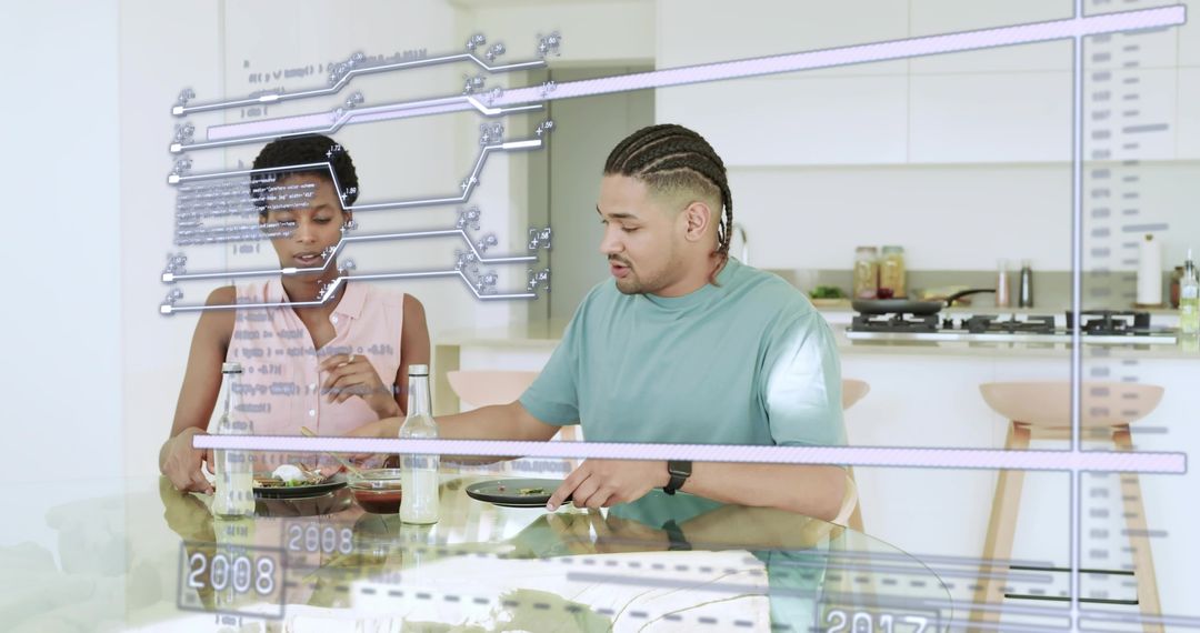 Couple eating while interacting with augmented reality display in modern kitchen lifestyle