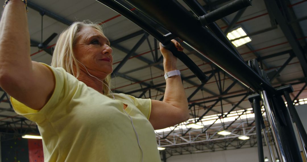 Senior Woman Doing Pull-Ups at Gym - Free Images, Stock Photos and Pictures on Pikwizard.com