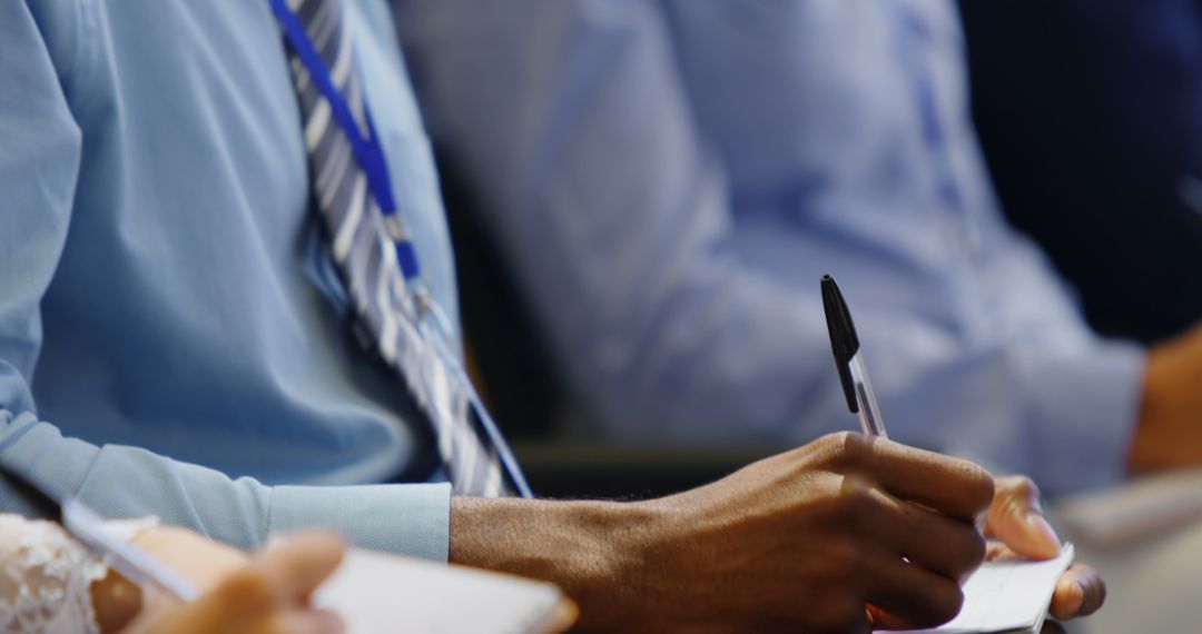 Diverse Professionals Taking Notes at Business Seminar
