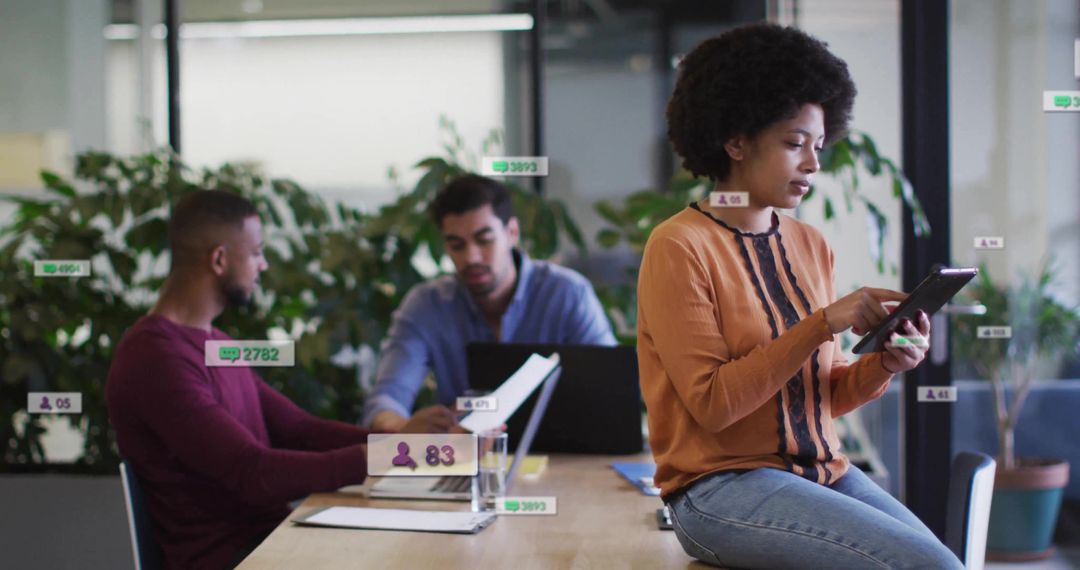 Team Collaborating in Modern Office with Technology and Documents