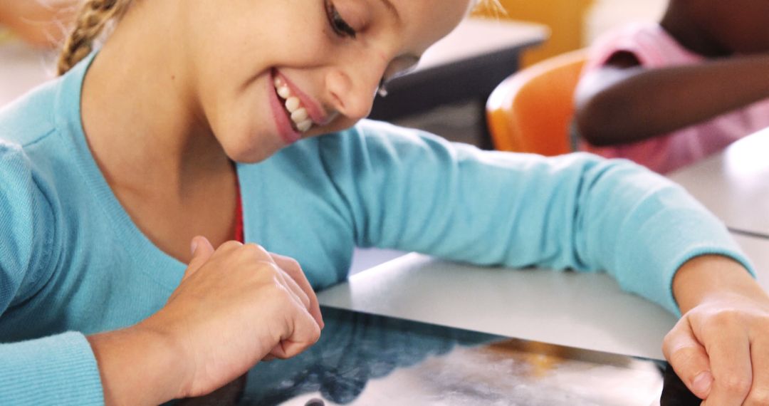 Girl Engaging with Digital Tablet in Classroom - Free Images, Stock Photos and Pictures on Pikwizard.com