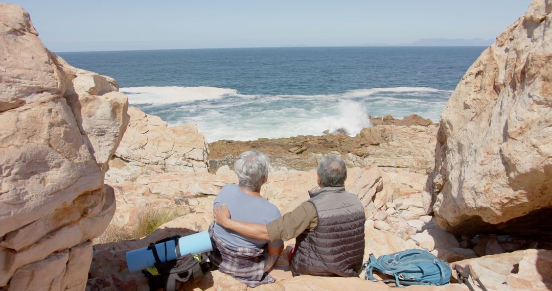 Happy Senior Couple Embracing During Scenic Hike by Ocean - Free Images, Stock Photos and Pictures on Pikwizard.com