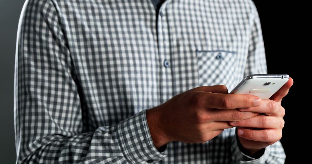 Person Texting Using Smartphone in Checked Shirt - Free Images, Stock Photos and Pictures on Pikwizard.com