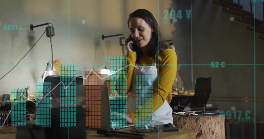 Artisan Entrepreneur Analyzing Financial Data With Smartphone and Laptop