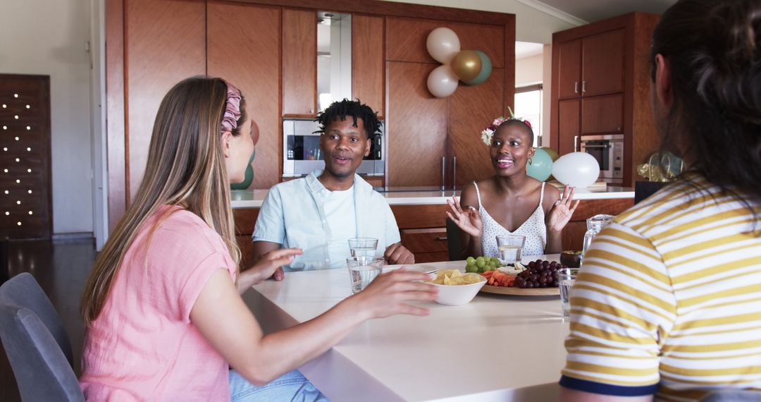Group of Friends Enjoying Home Gathering with Snacks