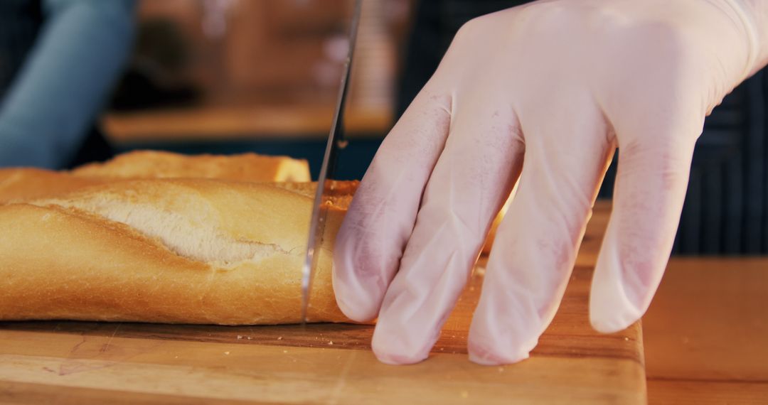 Chef Slicing Fresh Baguette with Precise Knife Skills - Free Images, Stock Photos and Pictures on Pikwizard.com