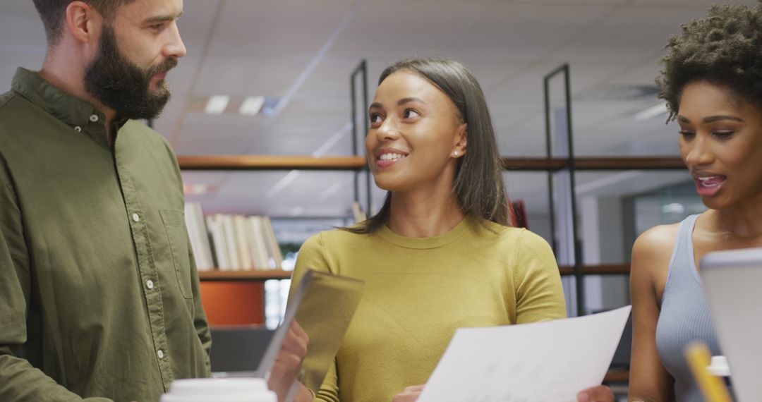Business Team Holding Documents in Office Discussion