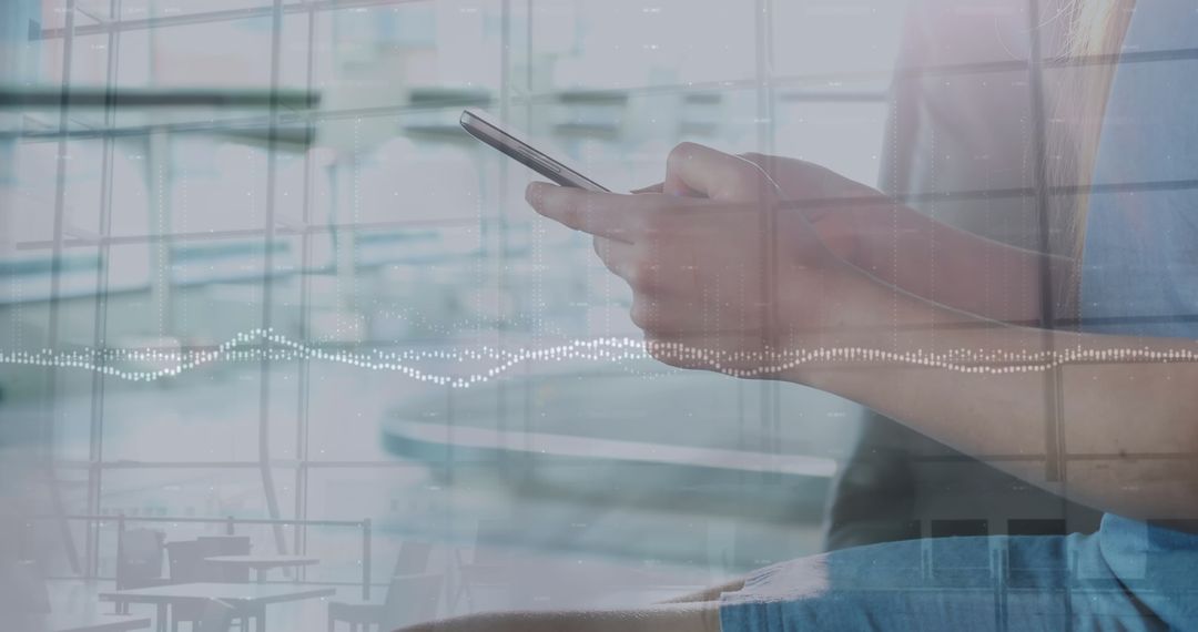 Young Woman Analyzing Data on Smartphone with Digital Graph Overlay