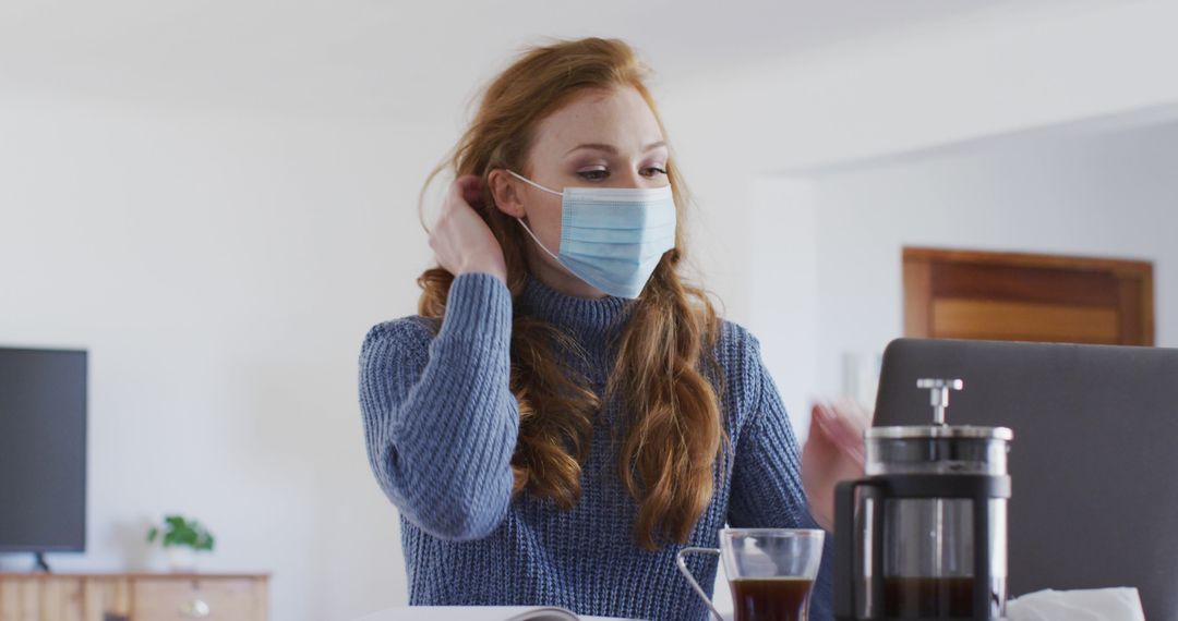 Woman Wearing Mask Drinking Coffee at Home during Pandemic - Free Images, Stock Photos and Pictures on Pikwizard.com