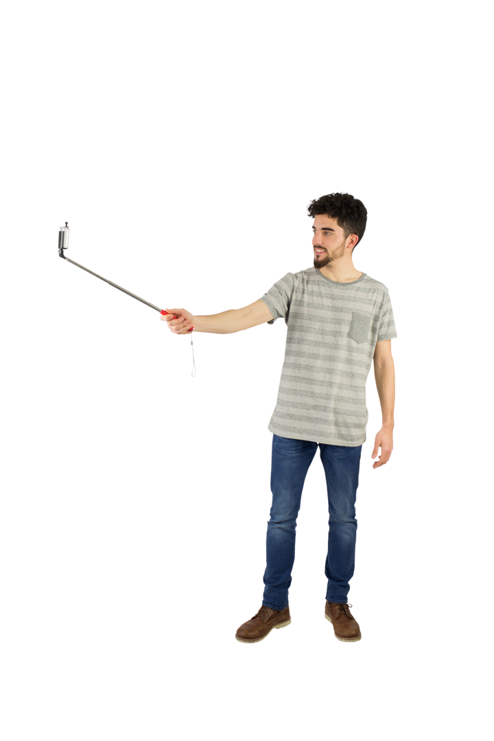 Casual Man Using Transparent Selfie Stick in Studio Setting - Download Free Stock Images Pikwizard.com