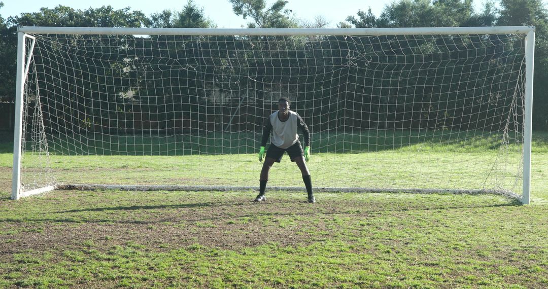 Soccer Goalkeeper Stand on Grass Field Ready for Action