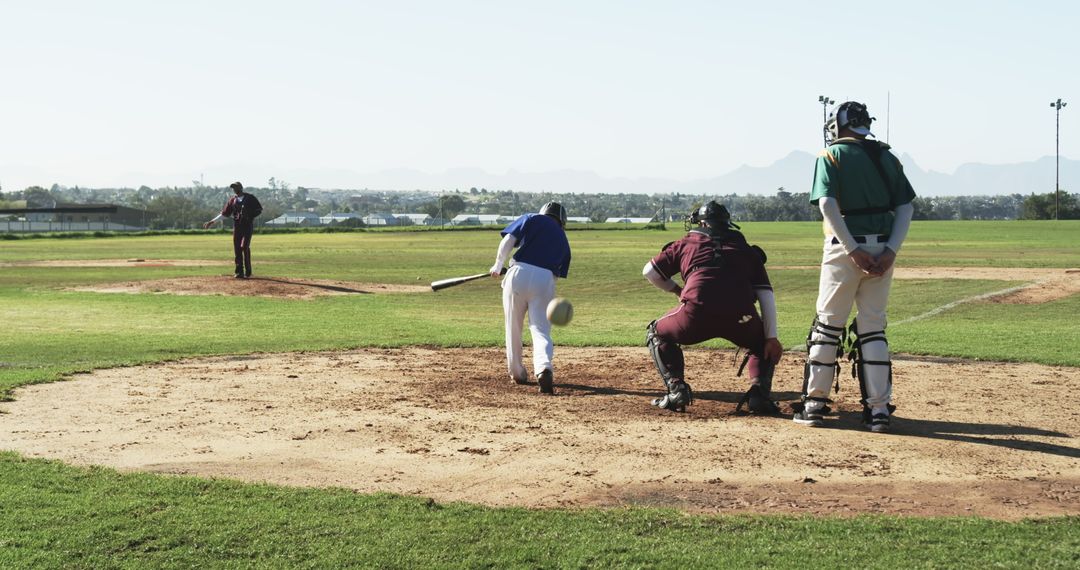 Baseball Player Bunting on Community Field