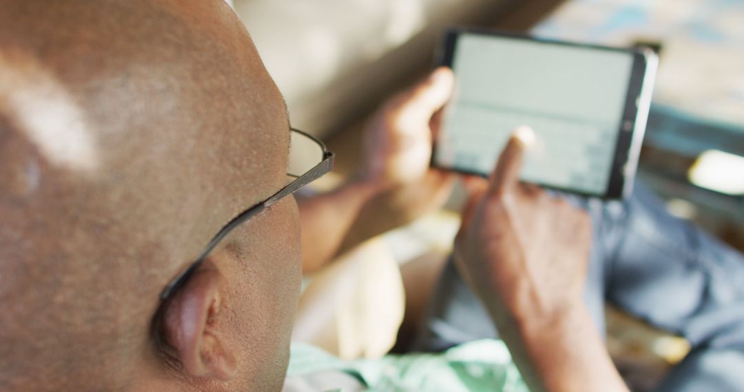 Close-up of Man Using Tablet at Home - Free Images, Stock Photos and Pictures on Pikwizard.com