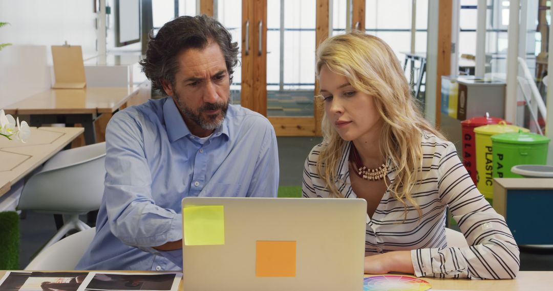 Professional Team Focusing on Collaborative Project in Office Workspace