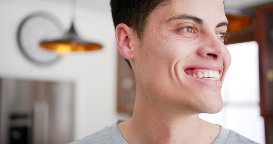 Joyful Man Relaxing in Bright Home Environment