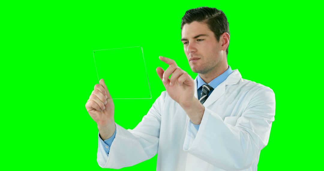 Male Scientist Holding Invisible Object on Green Screen Background - Free Images, Stock Photos and Pictures on Pikwizard.com