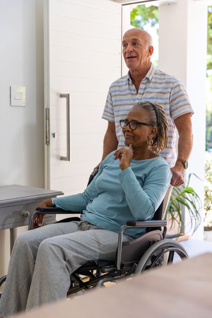 Senior Couple Navigating Home with Wheelchair Accessibility