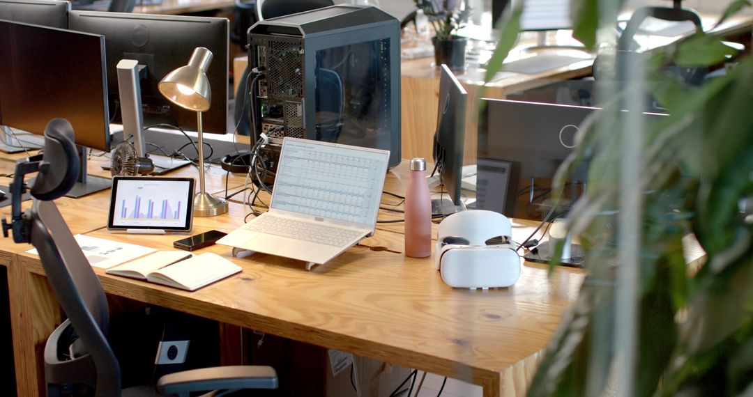 Modern Office Desk with Tech Gadgets and Business Data Displayed