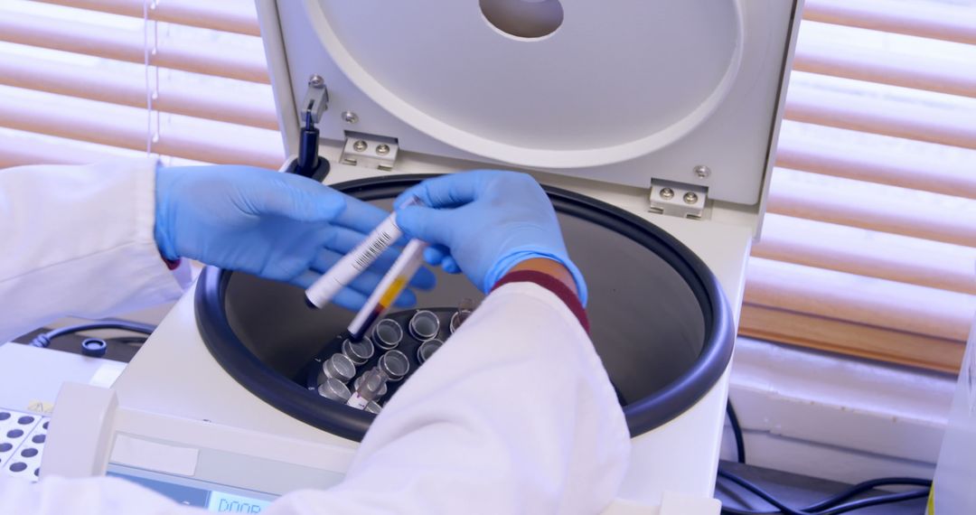 Scientist Using Centrifuge Machine in Laboratory - Free Images, Stock Photos and Pictures on Pikwizard.com