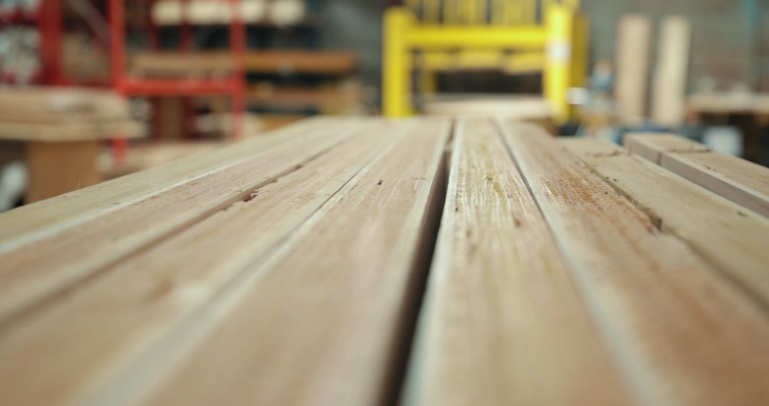 Stack of Wooden Planks in Carpentry Workshop Blurred Background - Free Images, Stock Photos and Pictures on Pikwizard.com