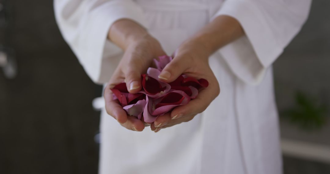 Woman Holding Rose Petals in Spa - Free Images, Stock Photos and Pictures on Pikwizard.com