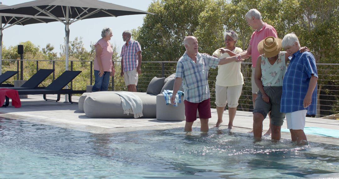 Smiling Senior Friends Enjoying Pool on Sunny Day - Free Images, Stock Photos and Pictures on Pikwizard.com