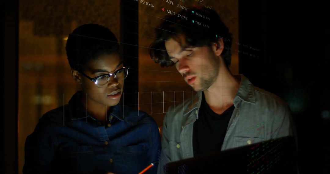 Diverse Colleagues Analyzing Financial Data on Screen