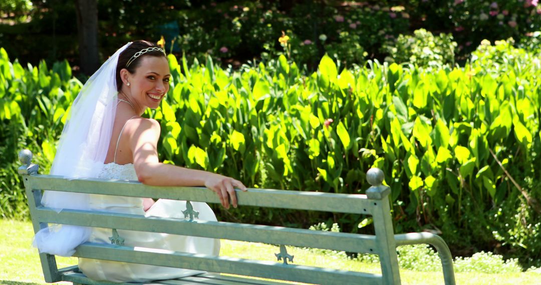 Joyful Bride Relaxing on Park Bench in Sunlit Garden - Free Images, Stock Photos and Pictures on Pikwizard.com