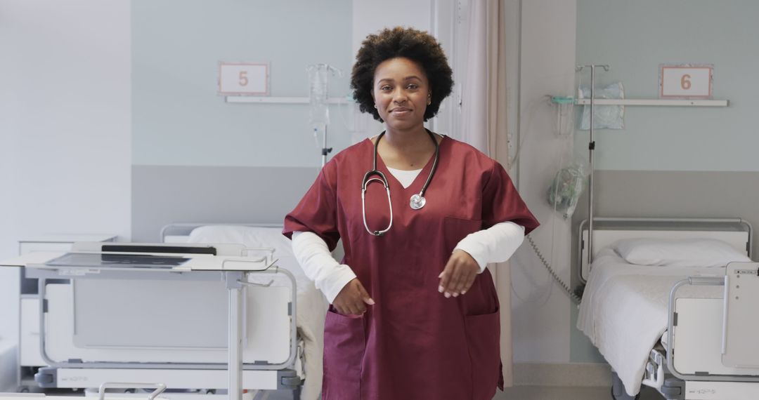 Confident African American Nurse Walking in Hospital Ward - Free Images, Stock Photos and Pictures on Pikwizard.com