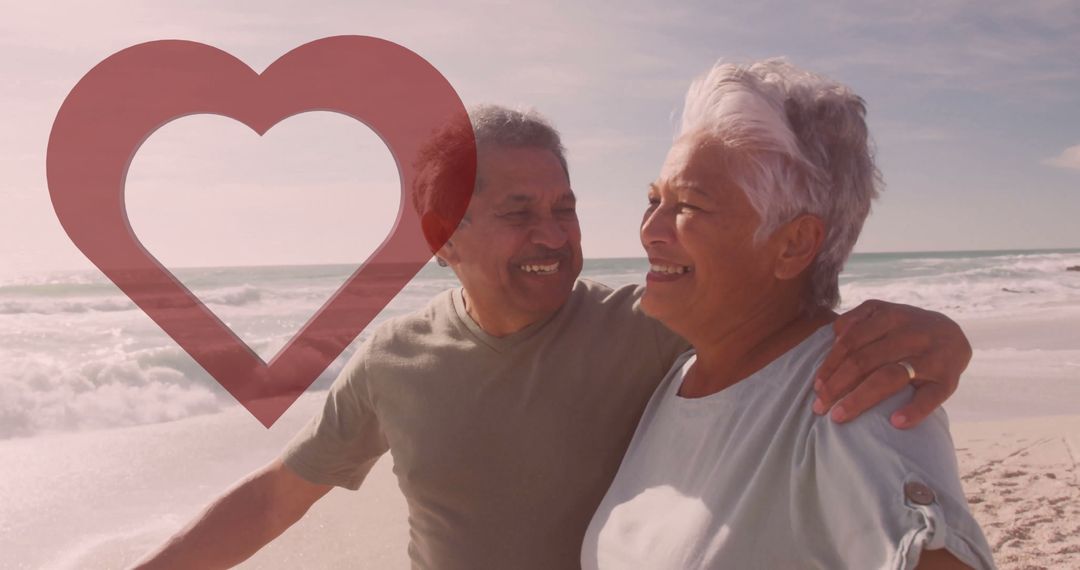Senior Couple Walking on Beach with Heart Symbol