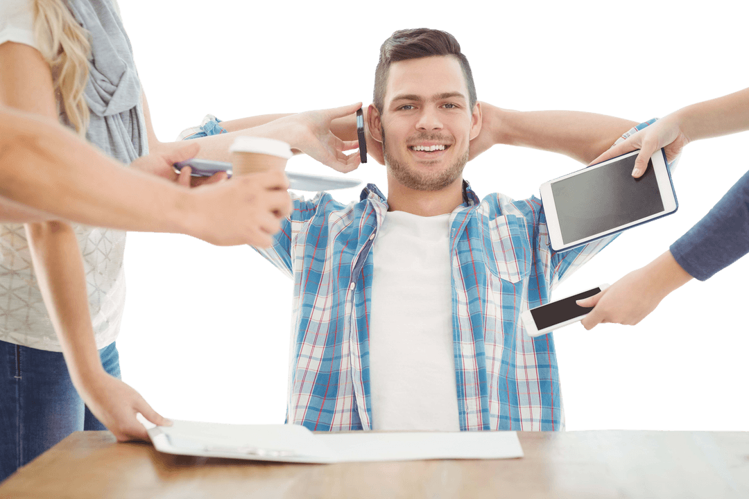 Smiling Man Sitting Relaxed Surrounded by Multiple Gadgets Transparent