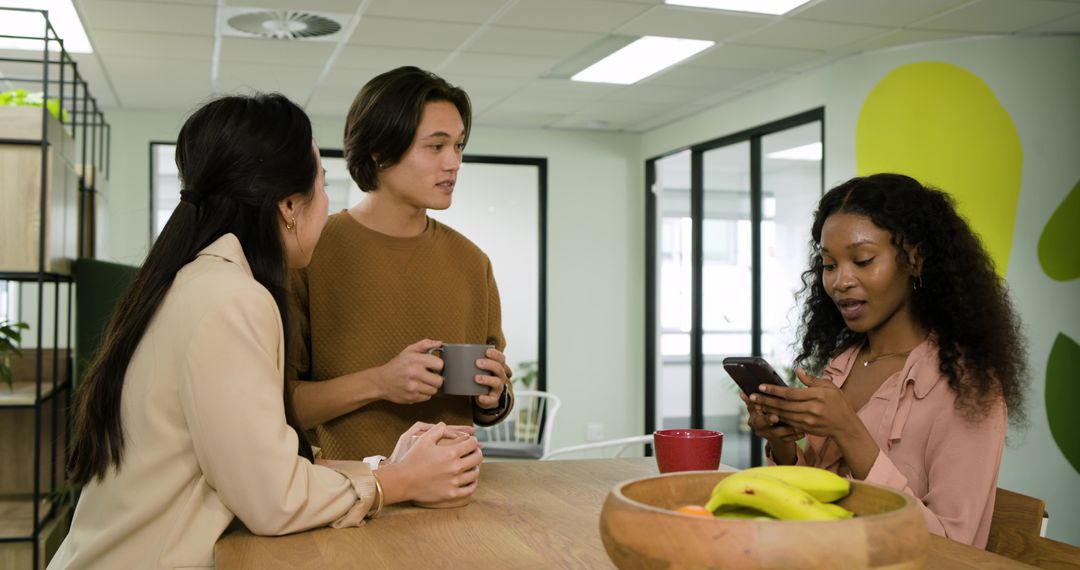 Diverse Colleagues Engaging in Relaxed Office Conversation