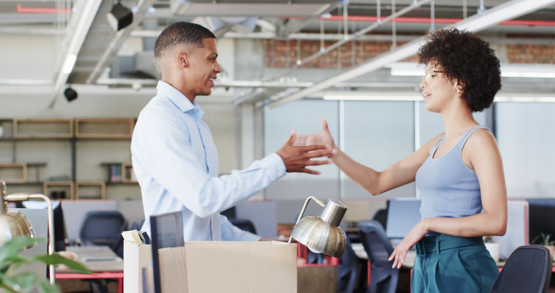 Colleagues Shaking Hands in Modern Office Inviting Partnership Opportunities