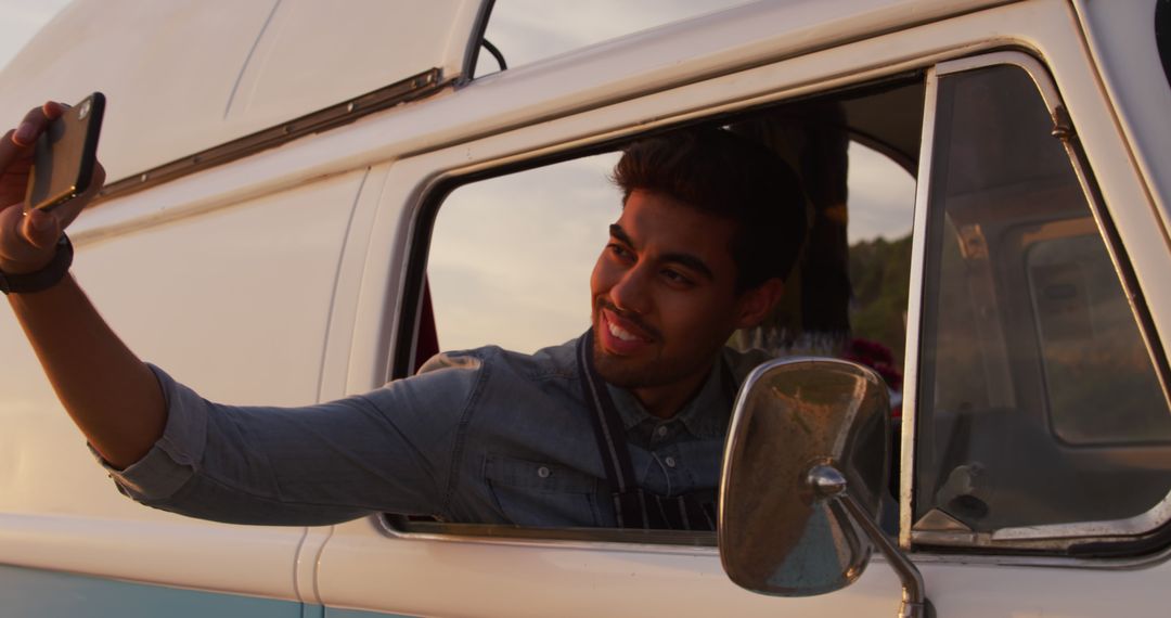 Young Man Taking Selfie in Vintage Camper Van at Sunset - Free Images, Stock Photos and Pictures on Pikwizard.com