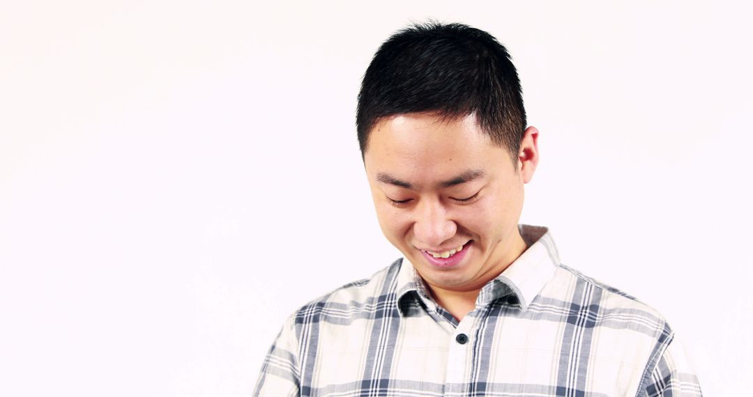 Cheerful Young Asian Man Smiling with Copy Space