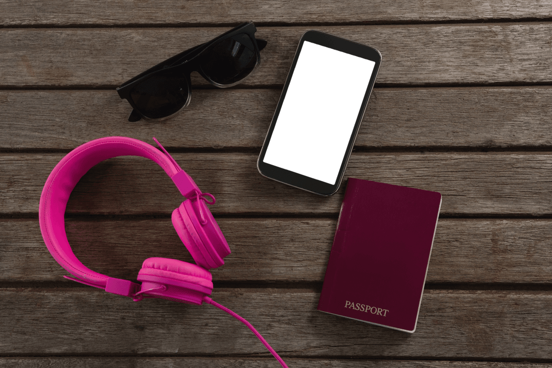 Transparent Travel Essentials: Smartphone, Sunglasses, Passport, Headphones