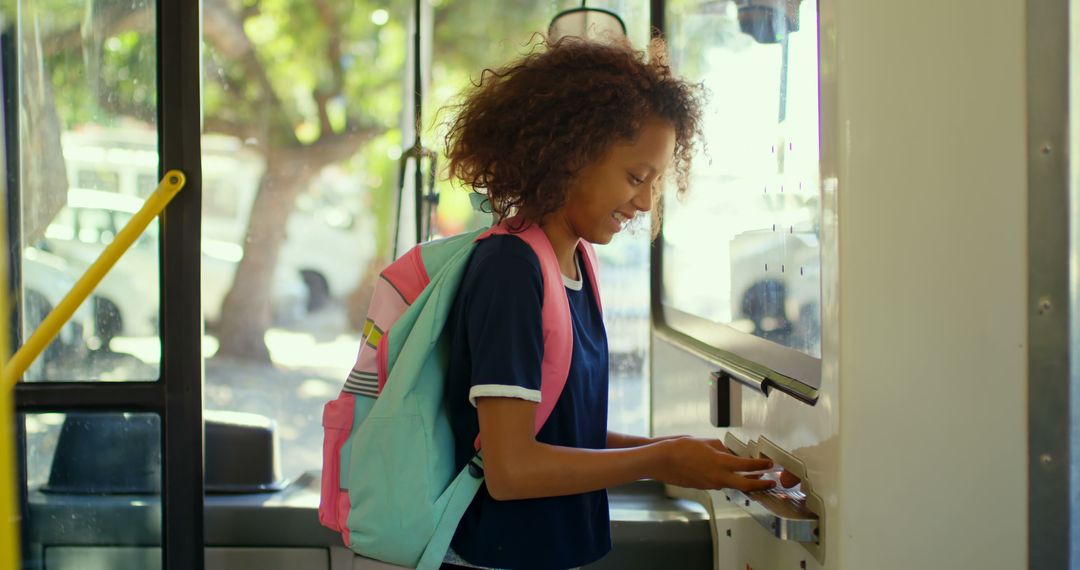 Smiling Student Paying Bus Fare Using Ticket Machine - Free Images, Stock Photos and Pictures on Pikwizard.com