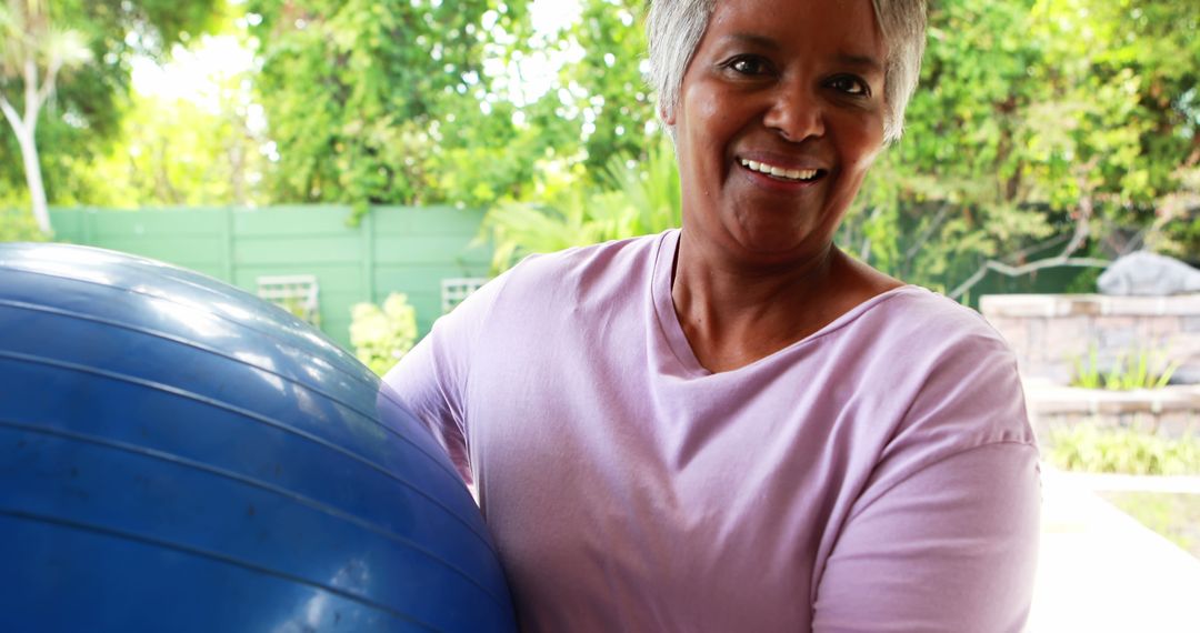 Senior Woman Exercising with Stability Ball Outdoors - Free Images, Stock Photos and Pictures on Pikwizard.com