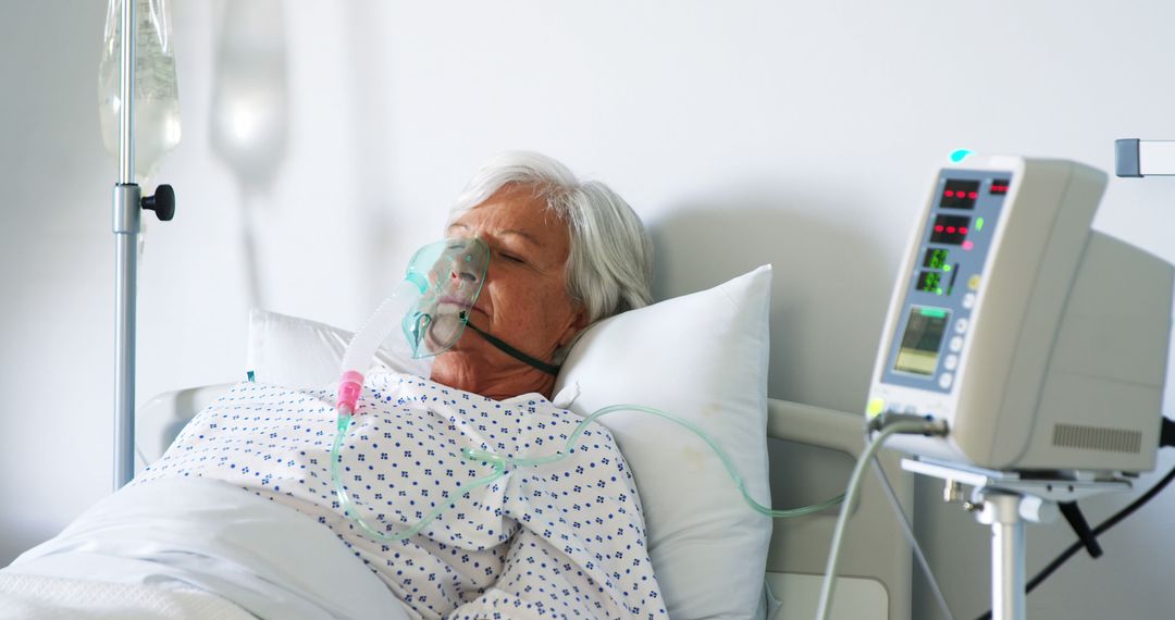 Elderly Patient Using Oxygen Mask in Hospital Bed - Free Images, Stock Photos and Pictures on Pikwizard.com